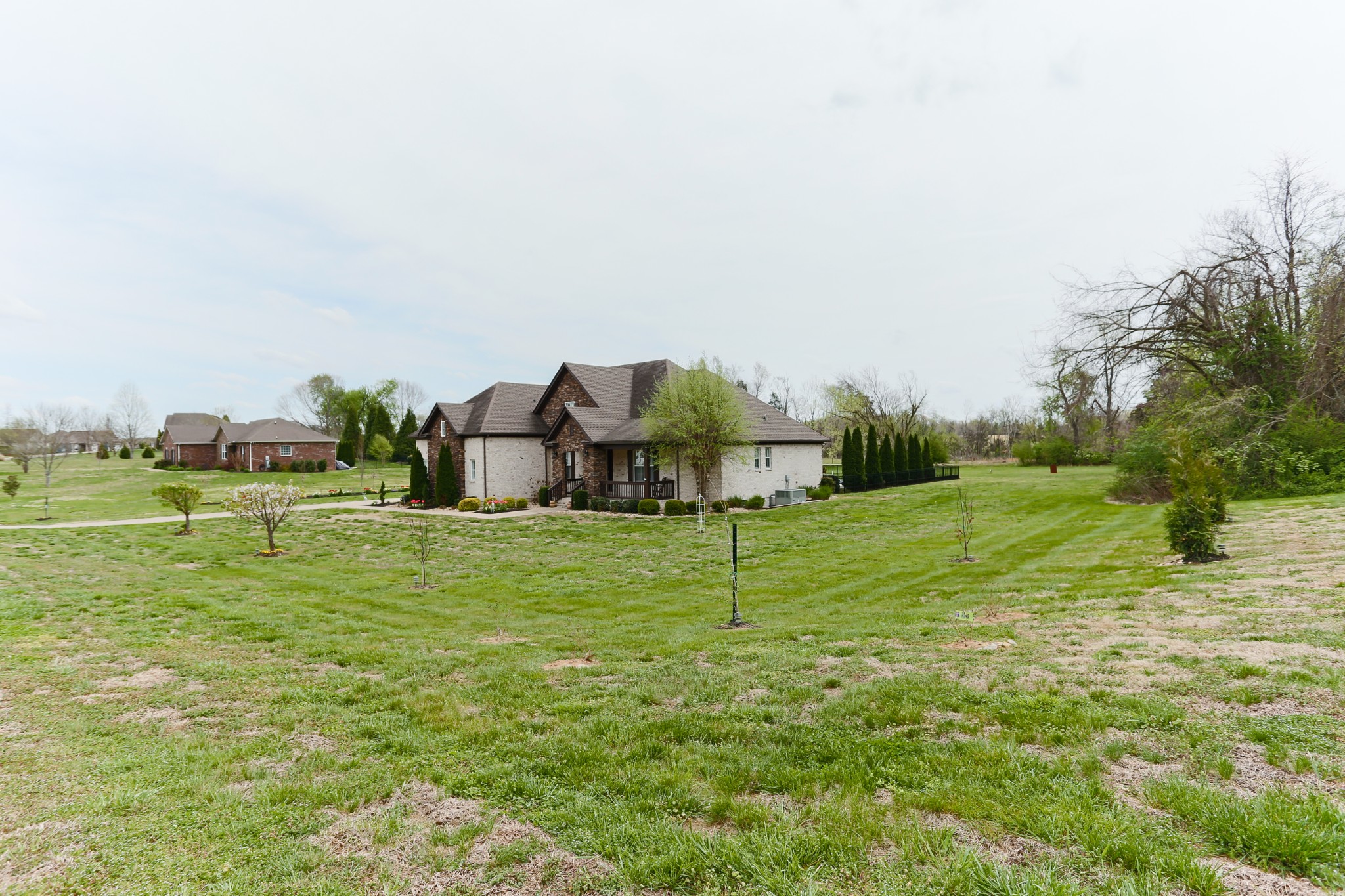 1700 Zevon Court Spring Hill, TN 37174 - Photo 4 of 71 a backyard of a house with table and chairs