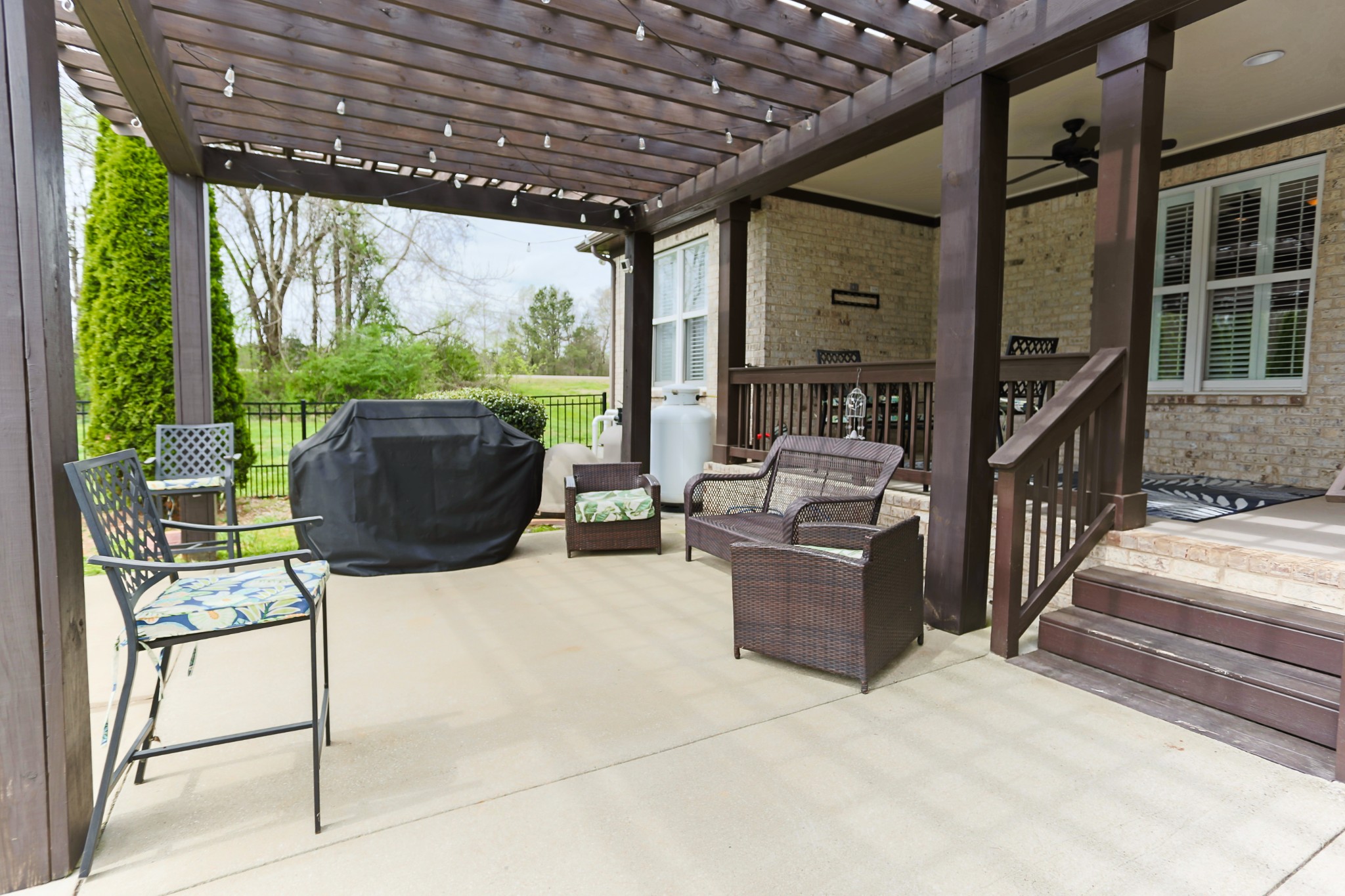 1700 Zevon Court Spring Hill, TN 37174 - Photo 55 of 71 a living room with patio furniture and a floor to ceiling window