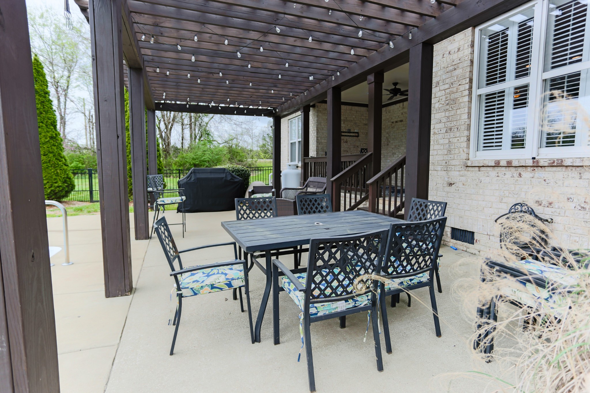 1700 Zevon Court Spring Hill, TN 37174 - Photo 56 of 71 a view of an outdoor dining space with a table and chairs