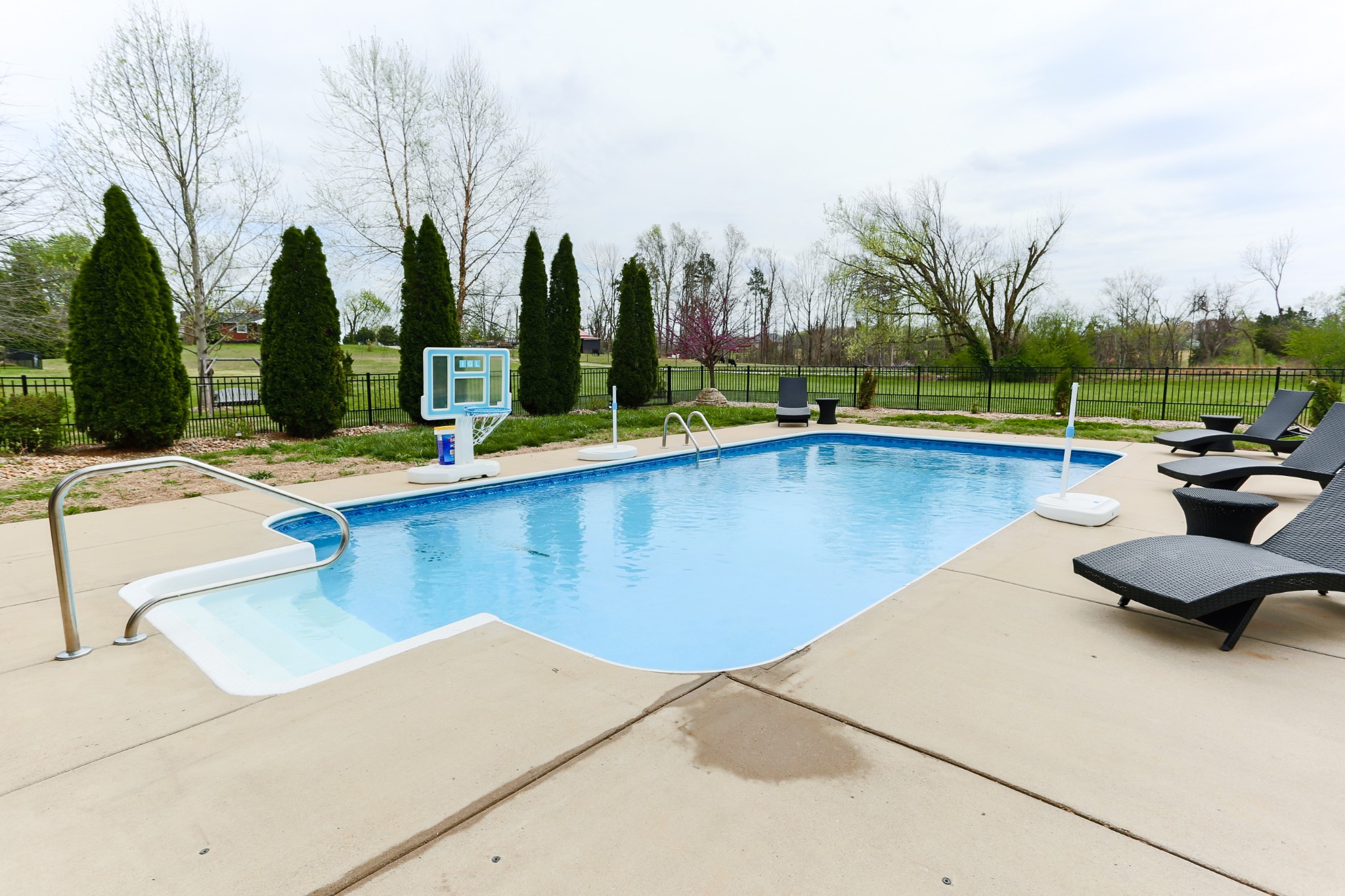 1700 Zevon Court Spring Hill, TN 37174 - Photo 59 of 71 a view of swimming pool with chairs and trees