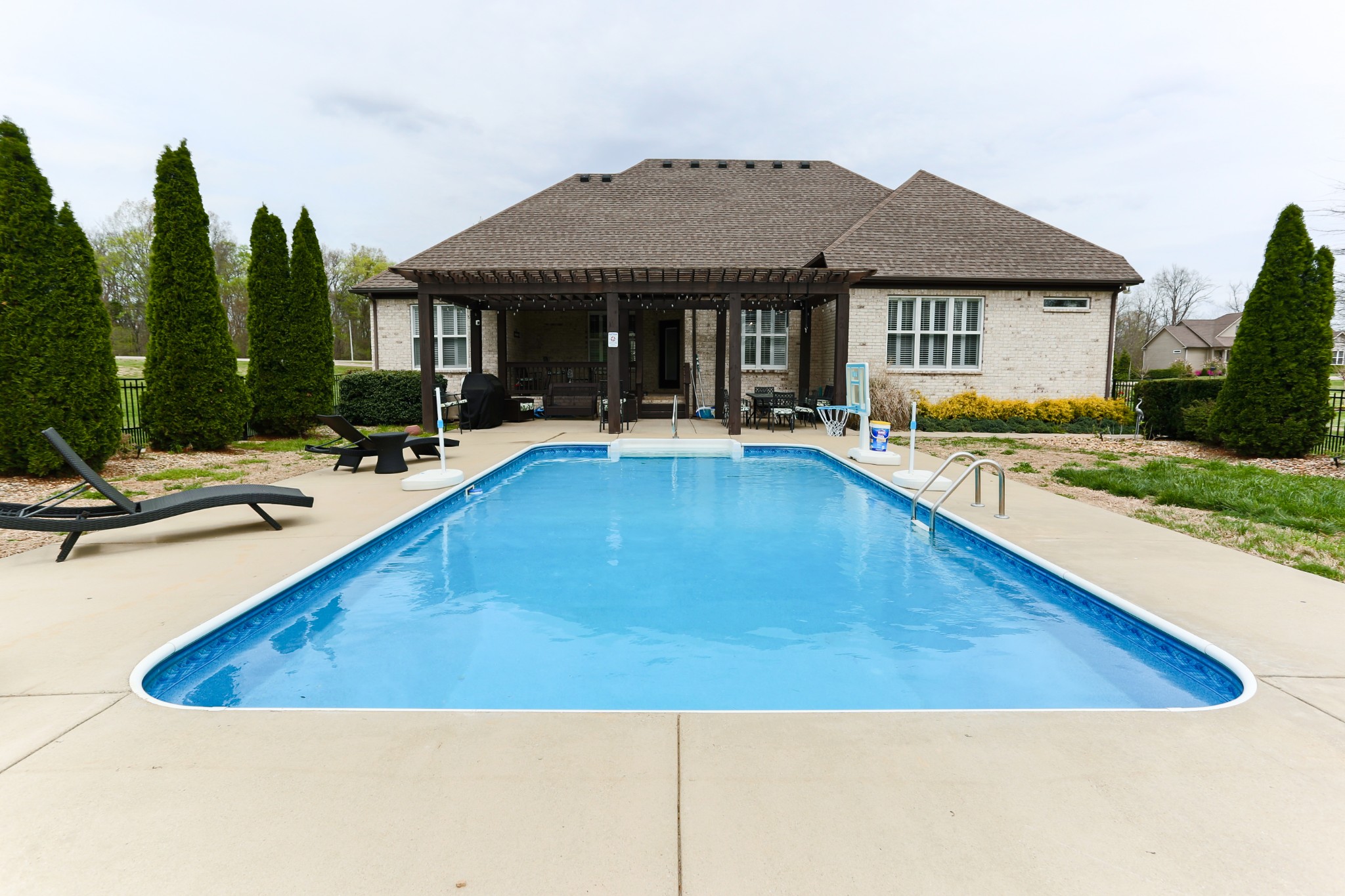 1700 Zevon Court Spring Hill, TN 37174 - Photo 60 of 71 a view of a house with swimming pool and sitting area