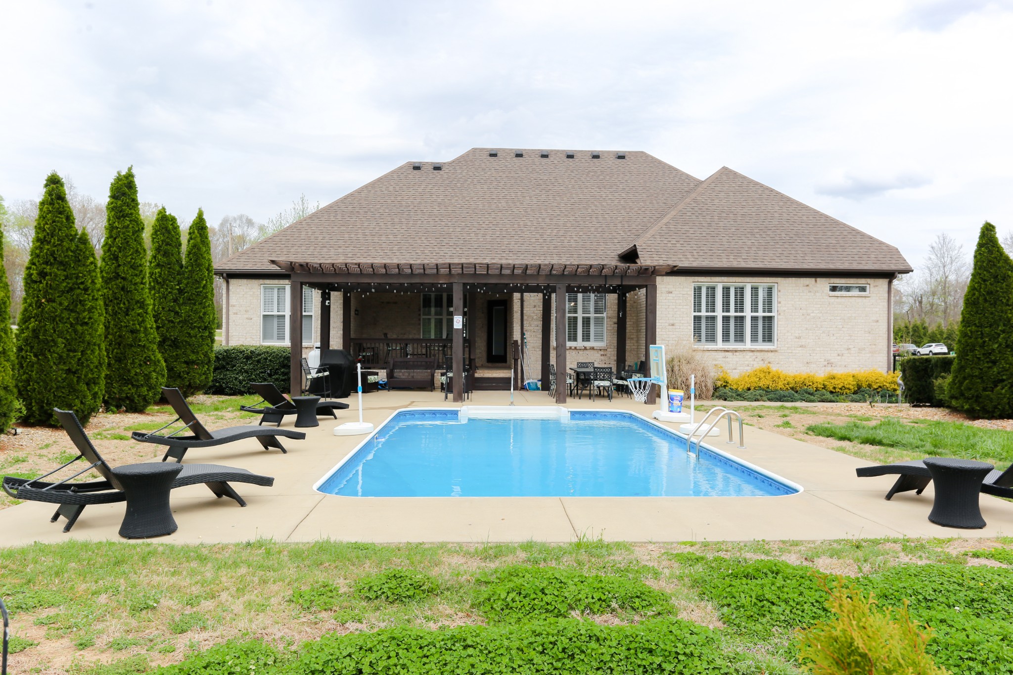 1700 Zevon Court Spring Hill, TN 37174 - Photo 71 of 71 a swimming pool with outdoor seating and yard