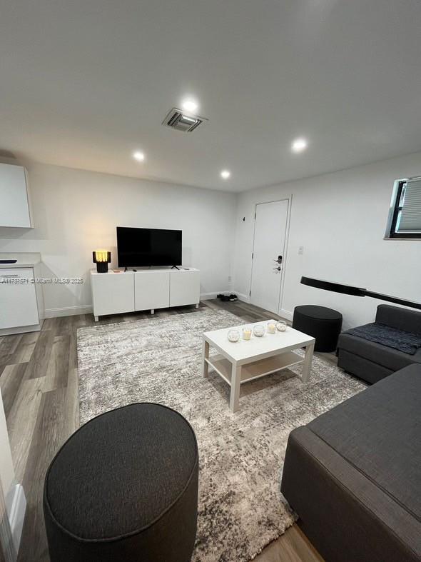 777 Southwest 9th Avenue, Unit 406 Miami, FL 33130 - Photo 4 of 11 a living room with furniture and a flat screen tv