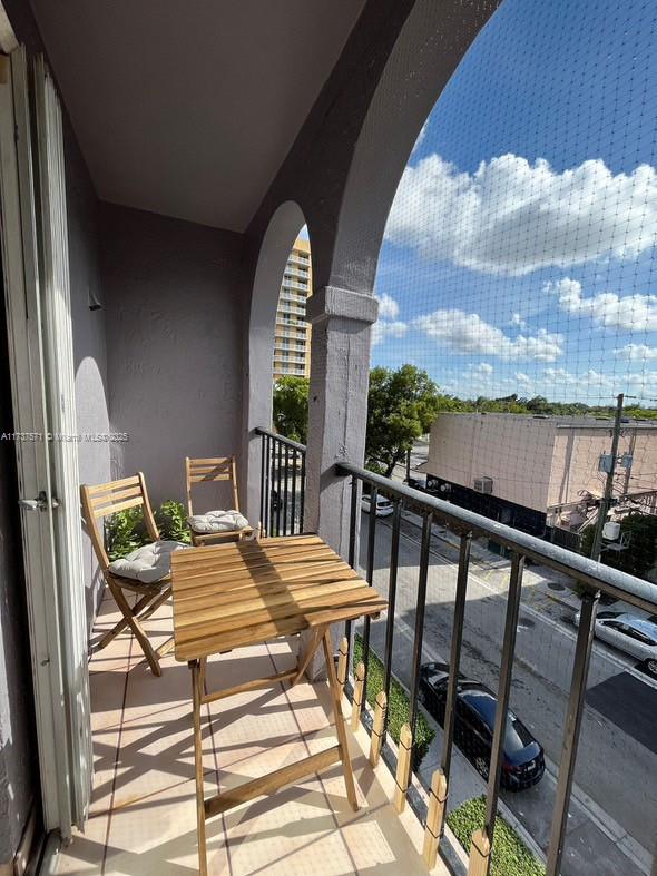 777 Southwest 9th Avenue, Unit 406 Miami, FL 33130 - Photo 9 of 11 a balcony view with couple of chairs