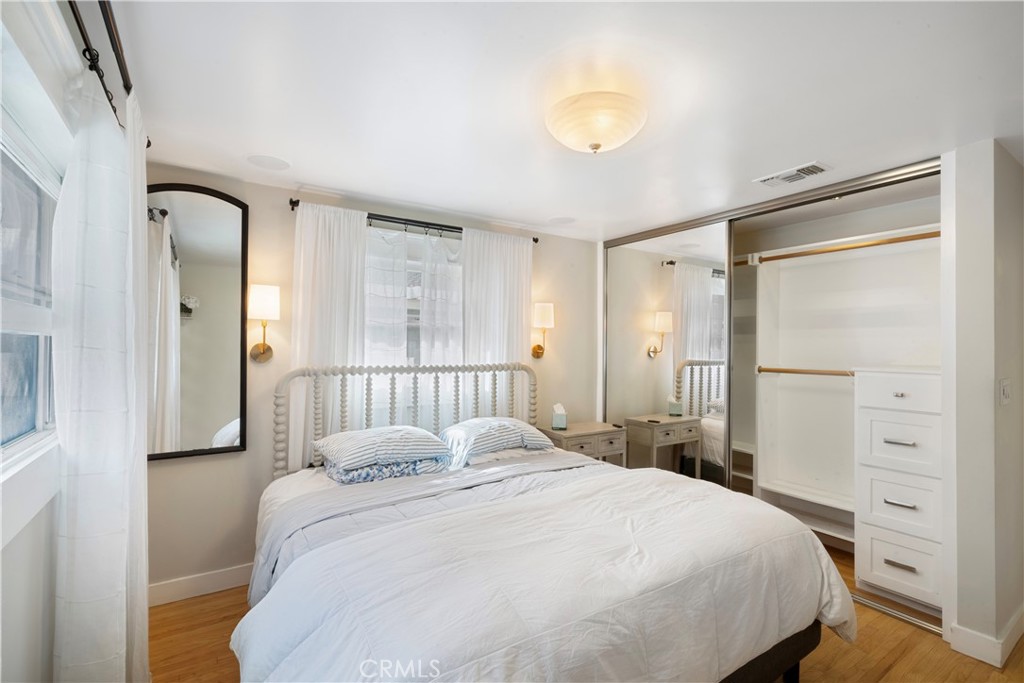 6736 Nicolett Street Riverside, CA 92504 - Photo 15 of 38 a bedroom with a bed and a window