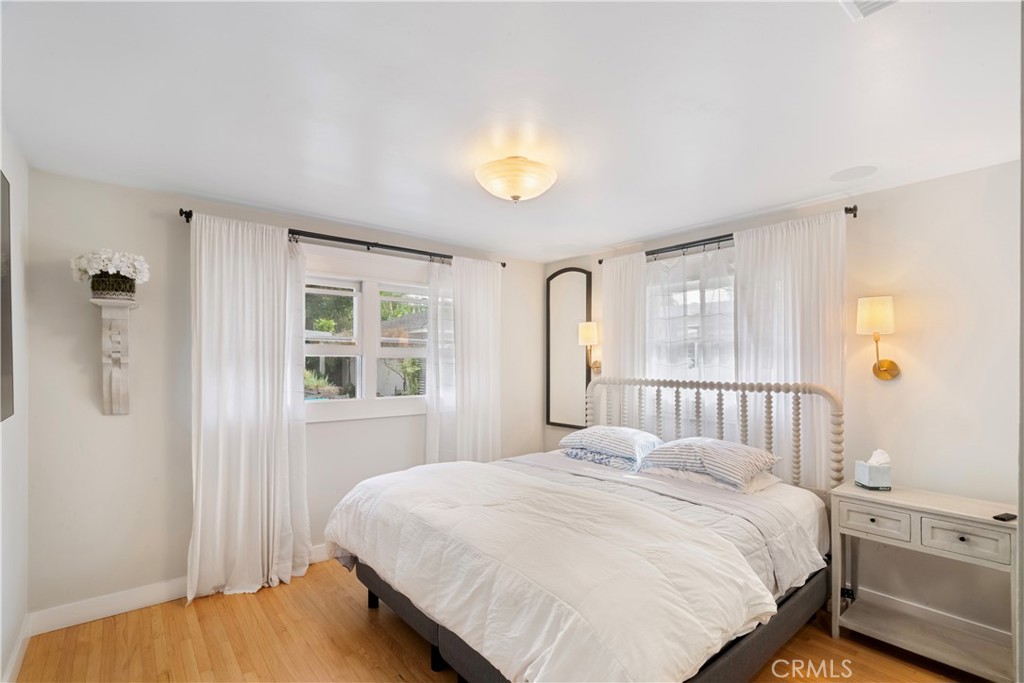 6736 Nicolett Street Riverside, CA 92504 - Photo 16 of 38 a bedroom with a bed and a window