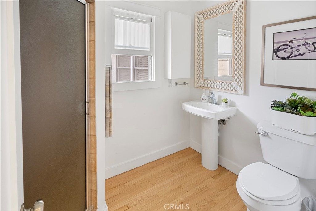 6736 Nicolett Street Riverside, CA 92504 - Photo 23 of 38 a bathroom with a sink toilet and window