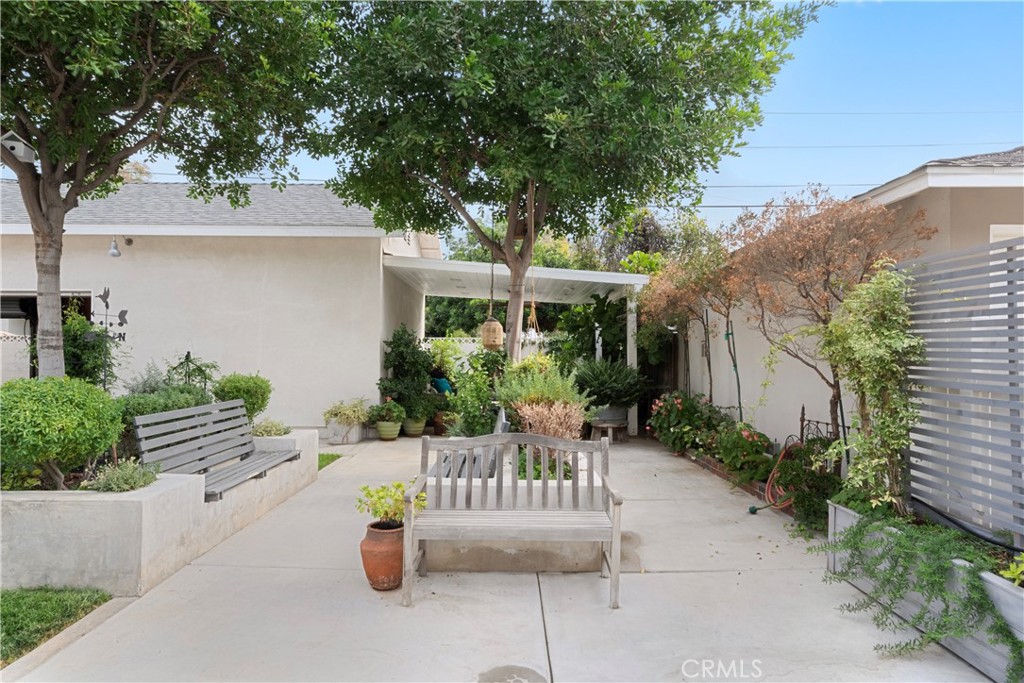 6736 Nicolett Street Riverside, CA 92504 - Photo 26 of 38 a view of a patio with couches table and chairs and potted plants