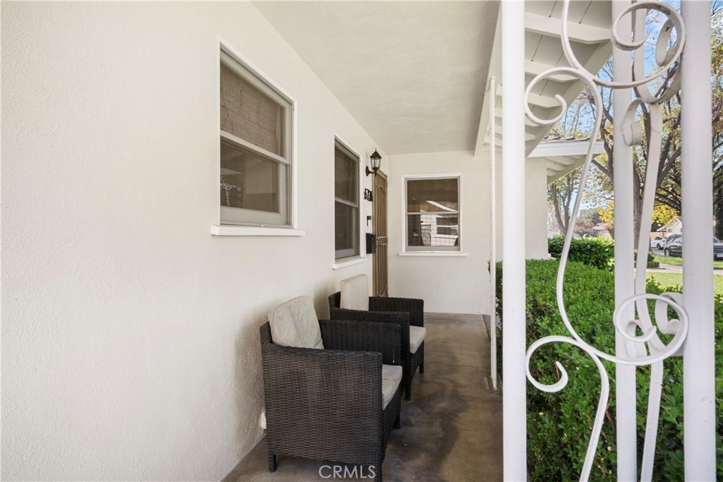 6736 Nicolett Street Riverside, CA 92504 - Photo 3 of 38 a living room with furniture and a floor to ceiling window