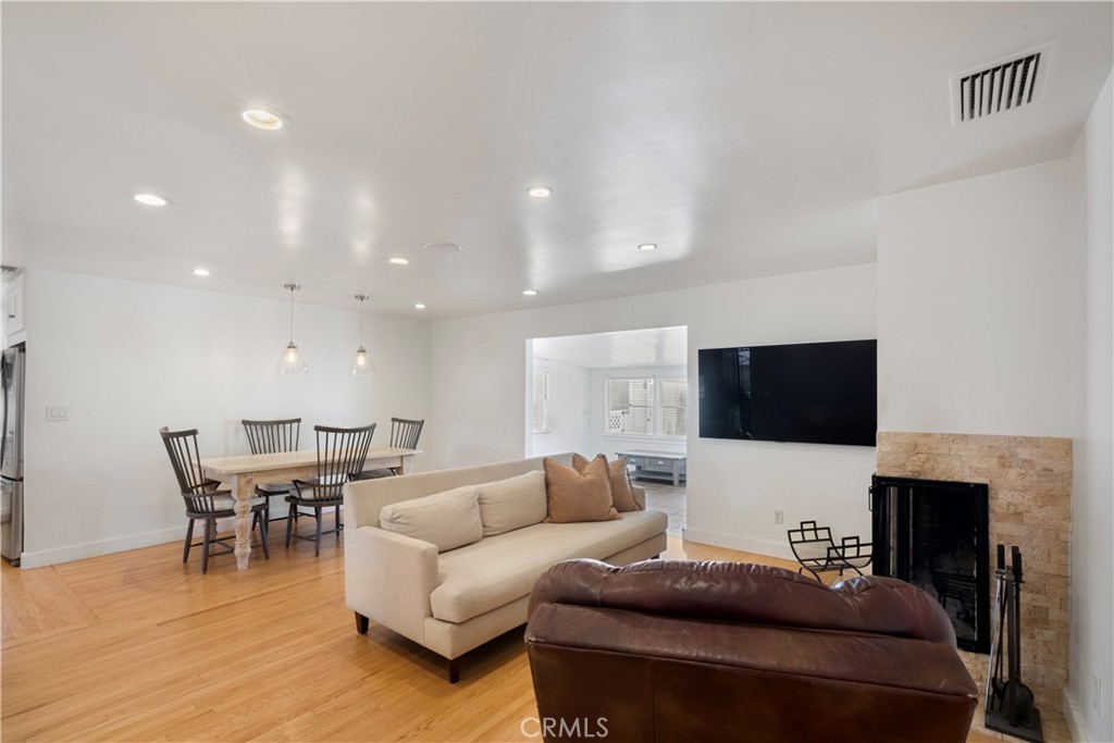 6736 Nicolett Street Riverside, CA 92504 - Photo 9 of 38 a living room with furniture and a flat screen tv
