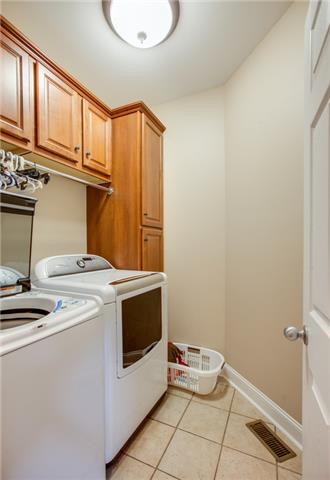 1939 Rock Springs Road Columbia, TN 38401 - Photo 16 of 19 The perfect laundry room with built in cabinets and tile floor.