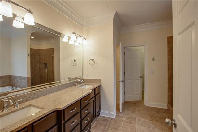 1939 Rock Springs Road Columbia, TN 38401 - Photo 8 of 19 Master bath with double sinks, tiled shower & floor and walk-in closet.
