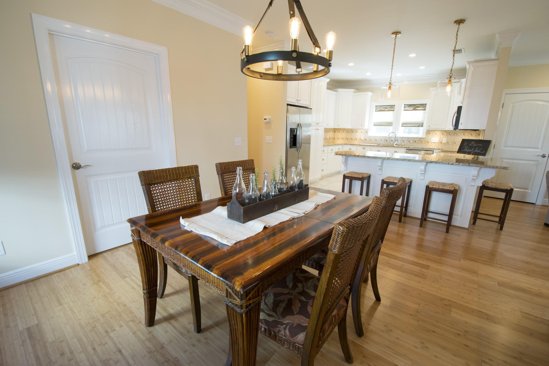 35 The Greenway Loop Inlet Beach, FL 32461 - Photo 16 of 37 a dining room with furniture a chandelier and wooden floor