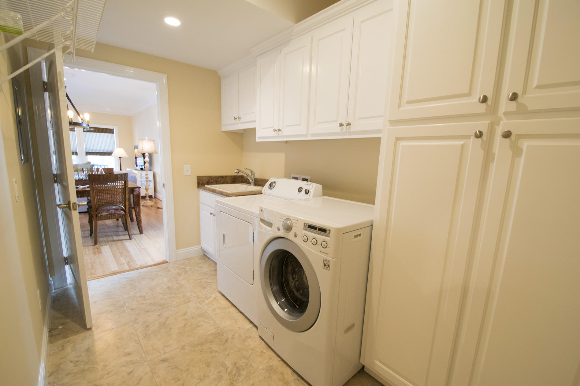35 The Greenway Loop Inlet Beach, FL 32461 - Photo 21 of 37 a utility room with sink dryer and washer