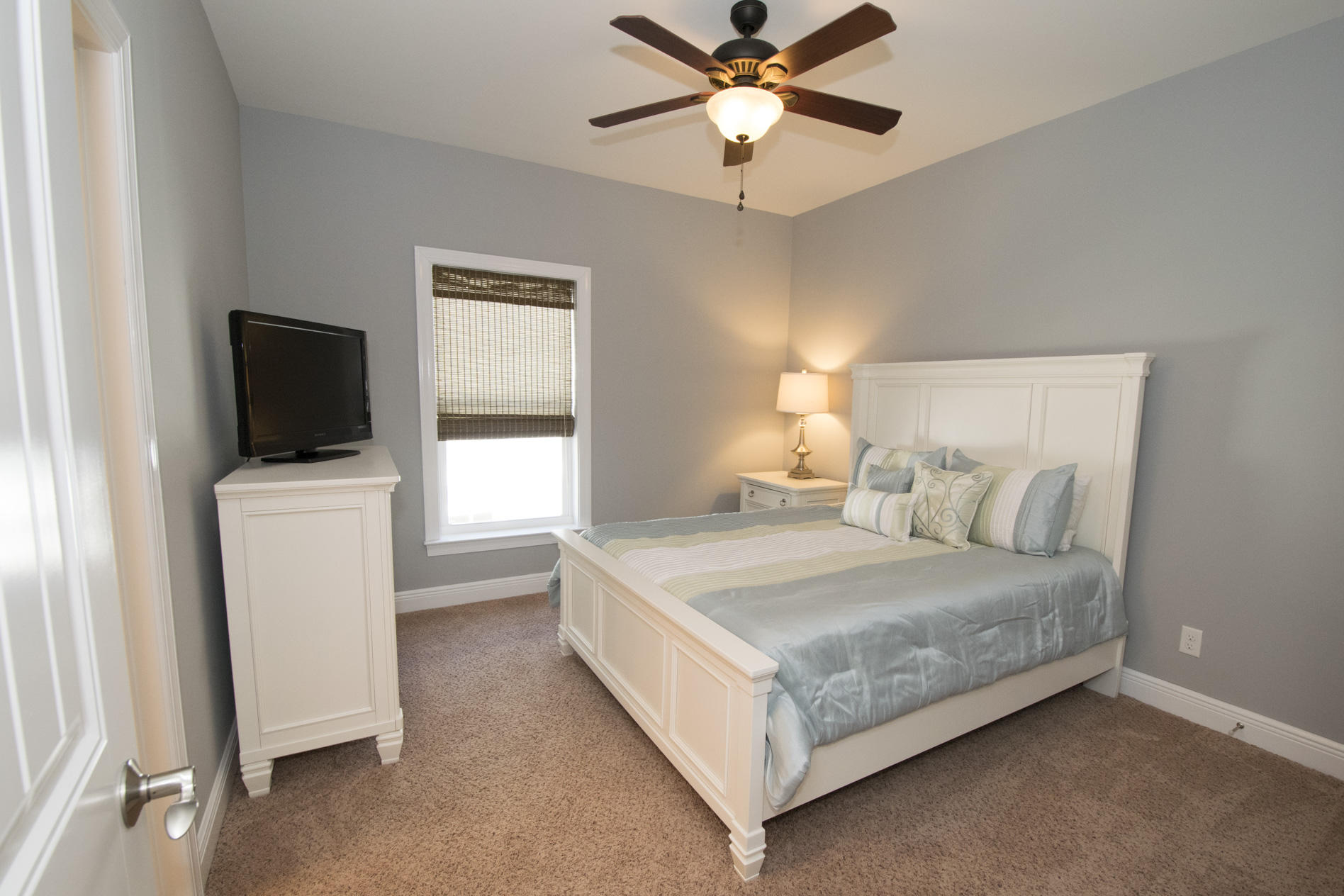 35 The Greenway Loop Inlet Beach, FL 32461 - Photo 26 of 37 a bedroom with a bed and a flat screen tv