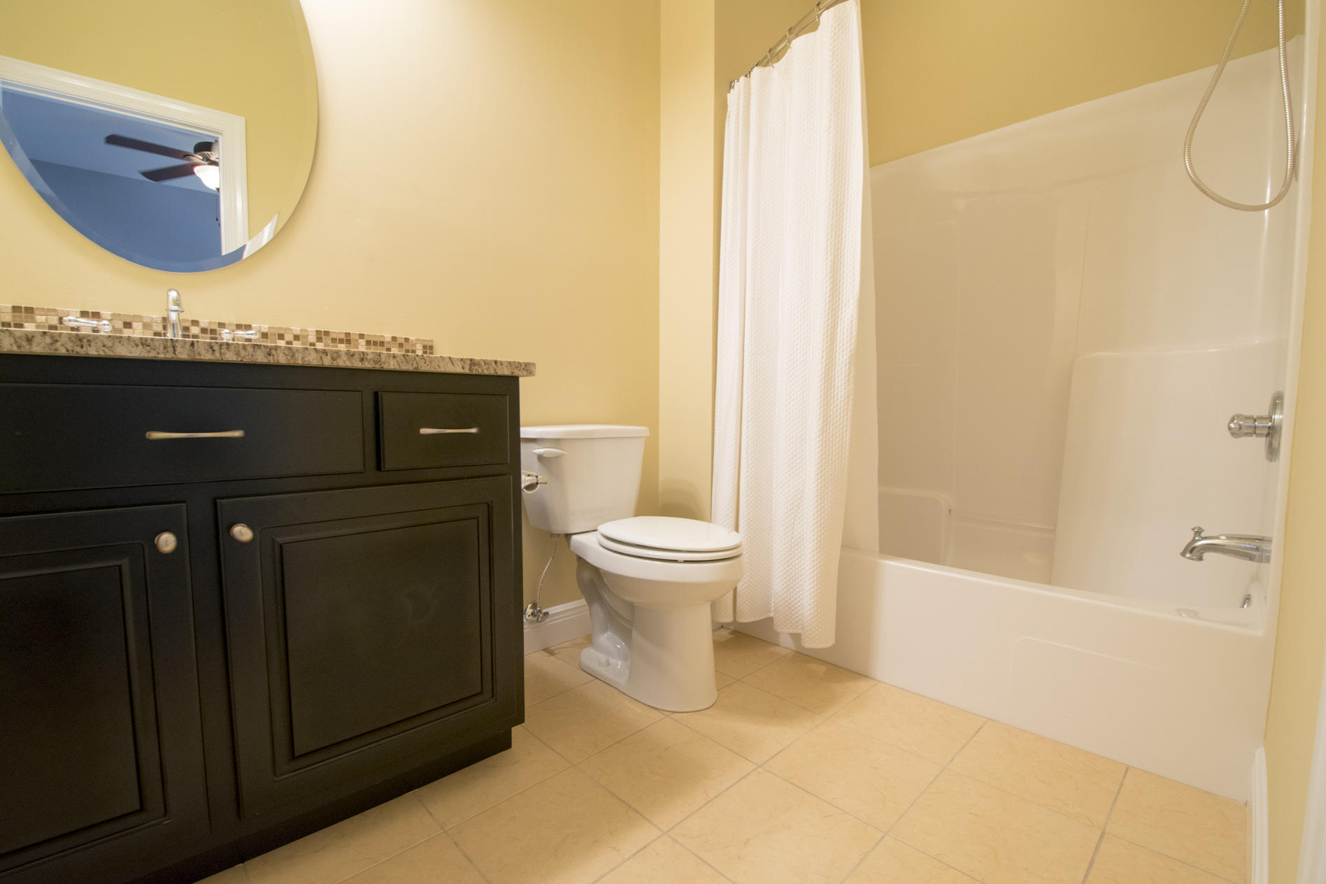 35 The Greenway Loop Inlet Beach, FL 32461 - Photo 27 of 37 a bathroom with a granite countertop sink and a mirror