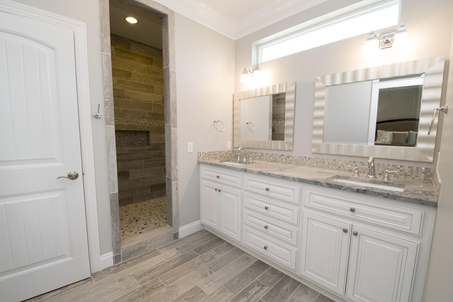 35 The Greenway Loop Inlet Beach, FL 32461 - Photo 30 of 37 a bathroom with a granite countertop sink and a mirror