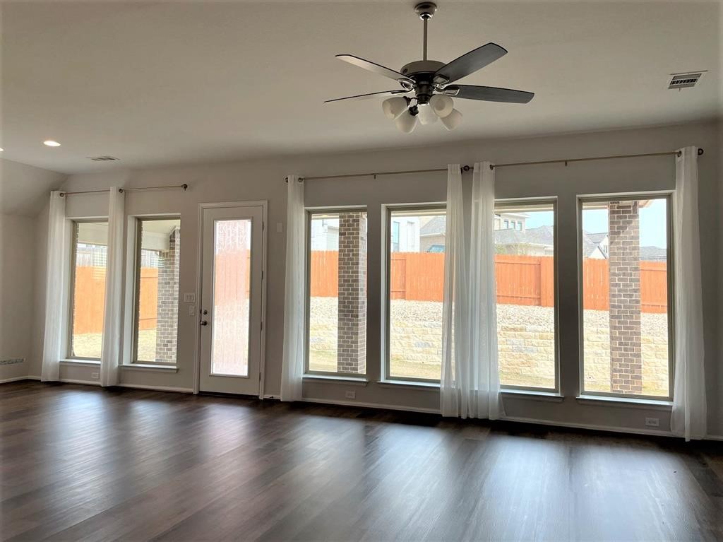 156 Santa Maria Street Georgetown, TX 78628 - Photo 17 of 40 Doorway to outside with a ceiling fan, wood finished floors, and recessed lighting
