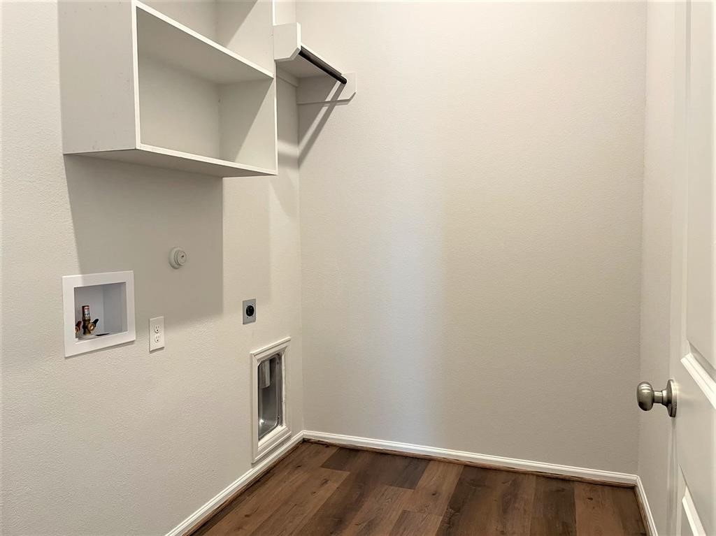 156 Santa Maria Street Georgetown, TX 78628 - Photo 24 of 40 Laundry room featuring dark wood-style floors, hookup for an electric dryer, washer hookup, and gas dryer hookup