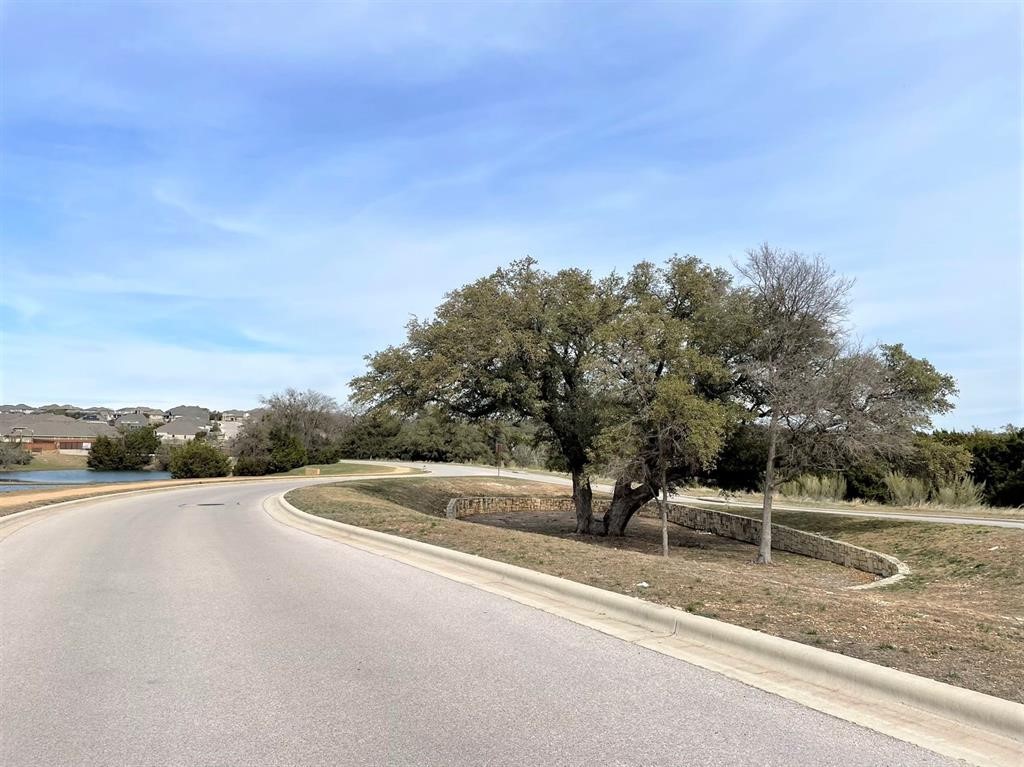 156 Santa Maria Street Georgetown, TX 78628 - Photo 38 of 40 View of asphalt road featuring curbs