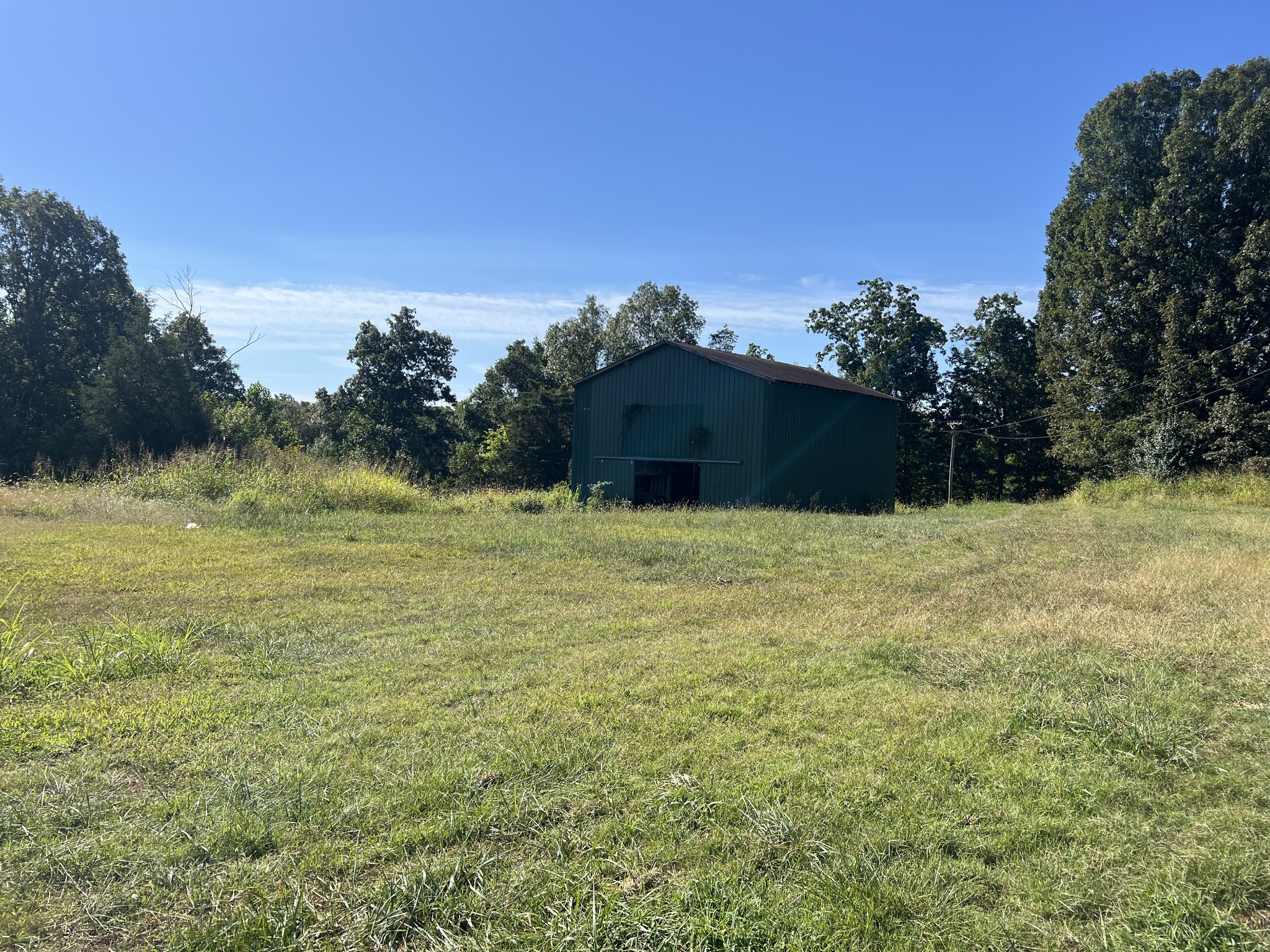 2043 Lafayette Road Red Boiling Springs, TN 37150 - Photo 11 of 12 a view of a large yard with a house in the background