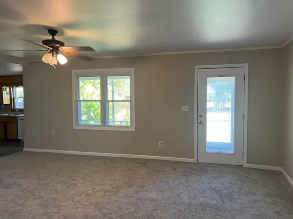 a view of an empty room with a window