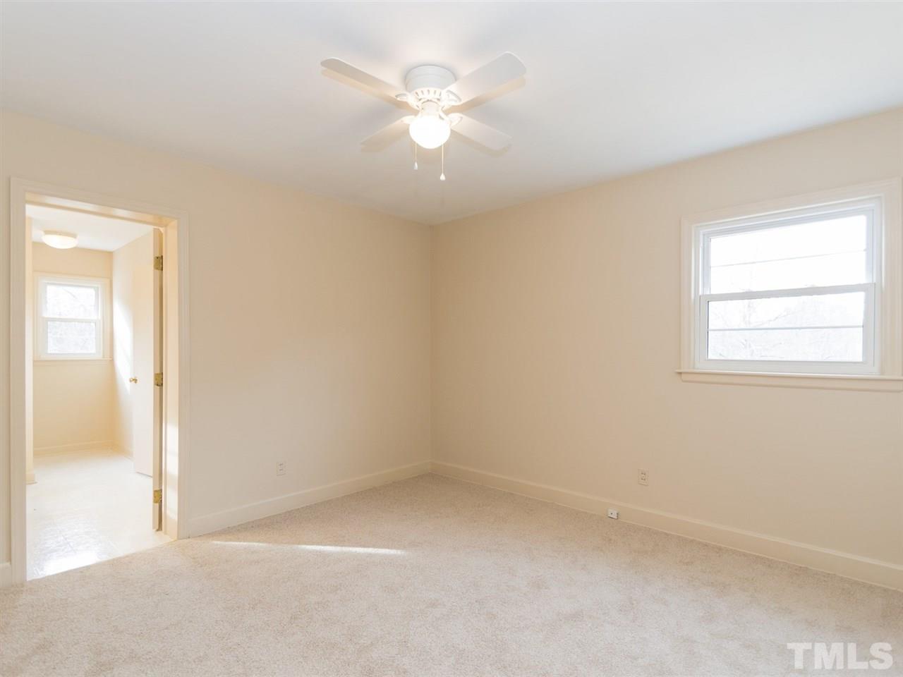 4321 James Road Raleigh, NC 27616 - Photo 11 of 23 wooden floor in an empty room with a window