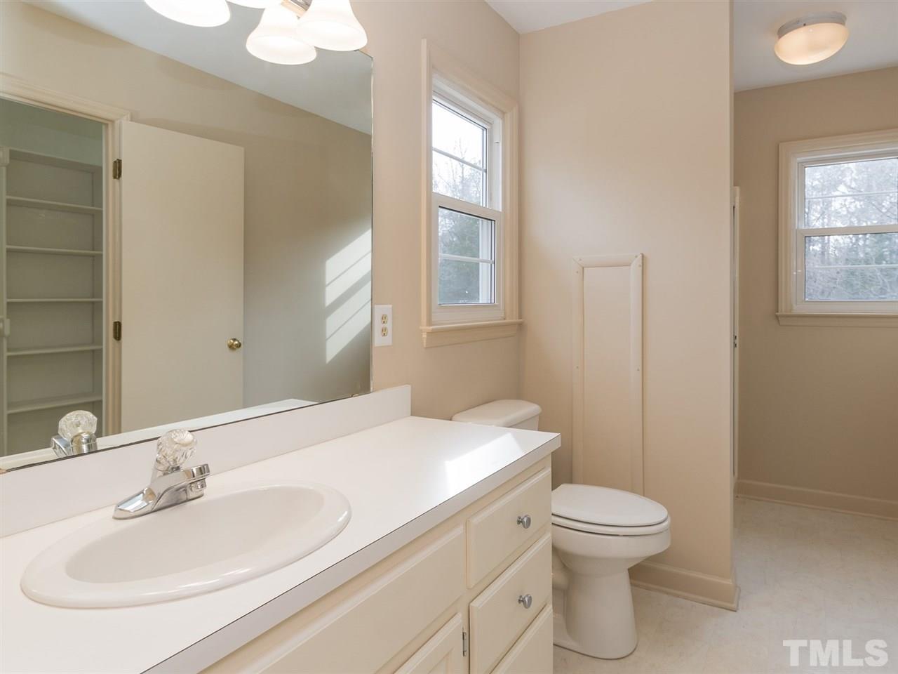 4321 James Road Raleigh, NC 27616 - Photo 13 of 23 a bathroom with a sink toilet and window