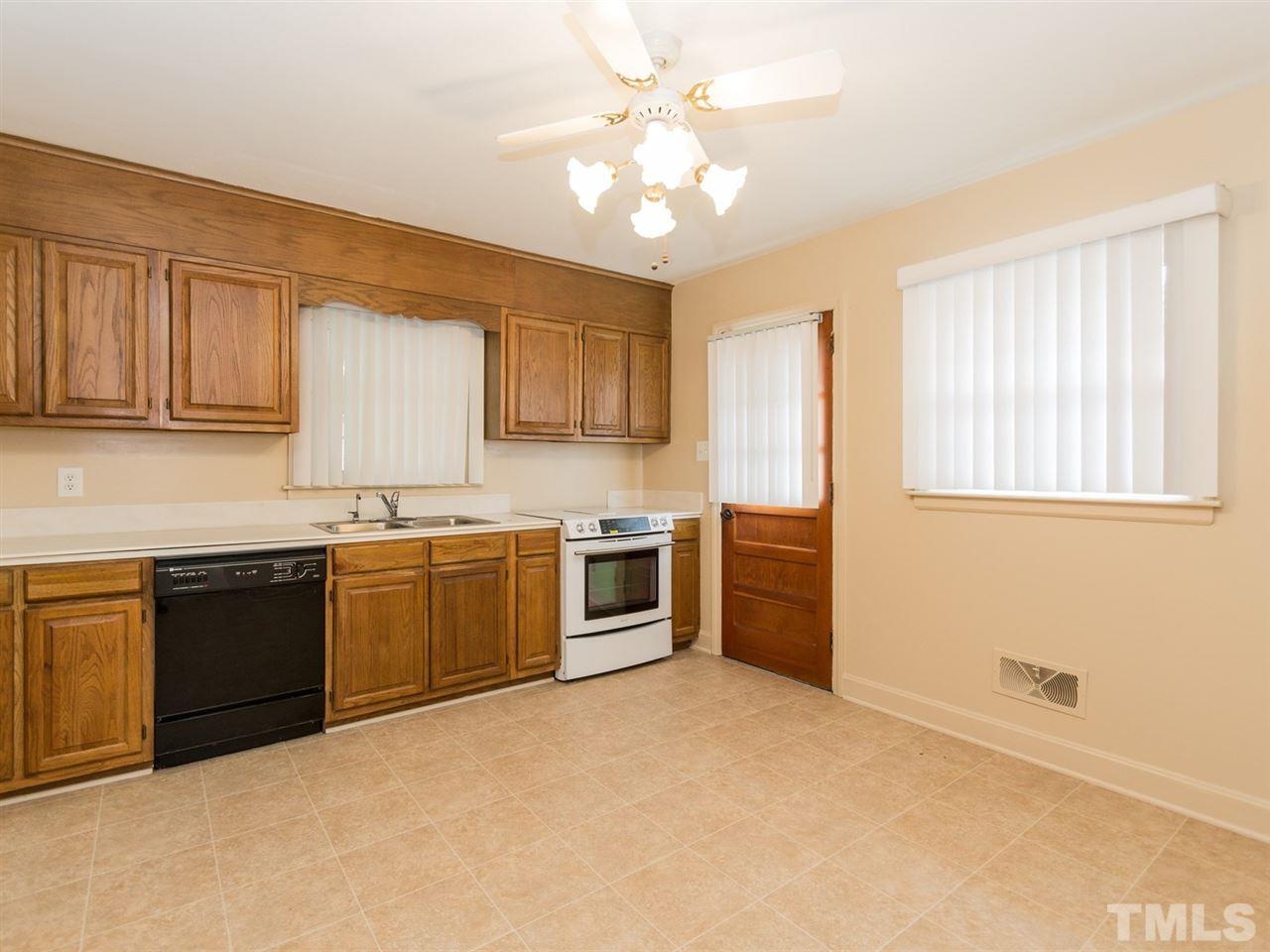 4321 James Road Raleigh, NC 27616 - Photo 7 of 23 a kitchen with a stove a sink and a refrigerator