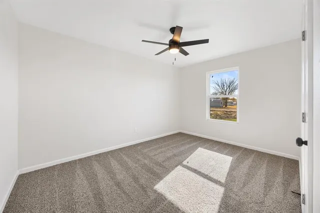 a view of empty room with windows
