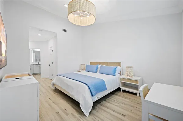 a bedroom with a bed and a table