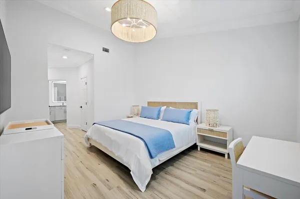 a bedroom with a bed and a table