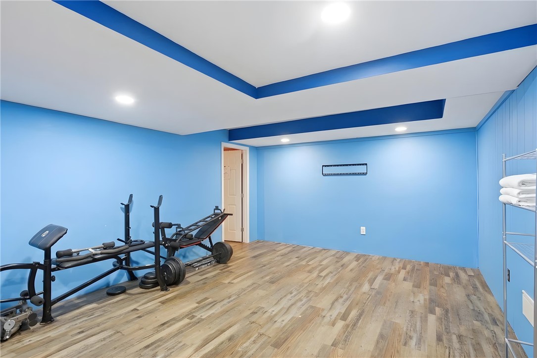 311 Cumberland Way Anderson, SC 29621 - Photo 31 of 44 An inviting exercise room features durable wood flooring and unique recessed ceiling details.