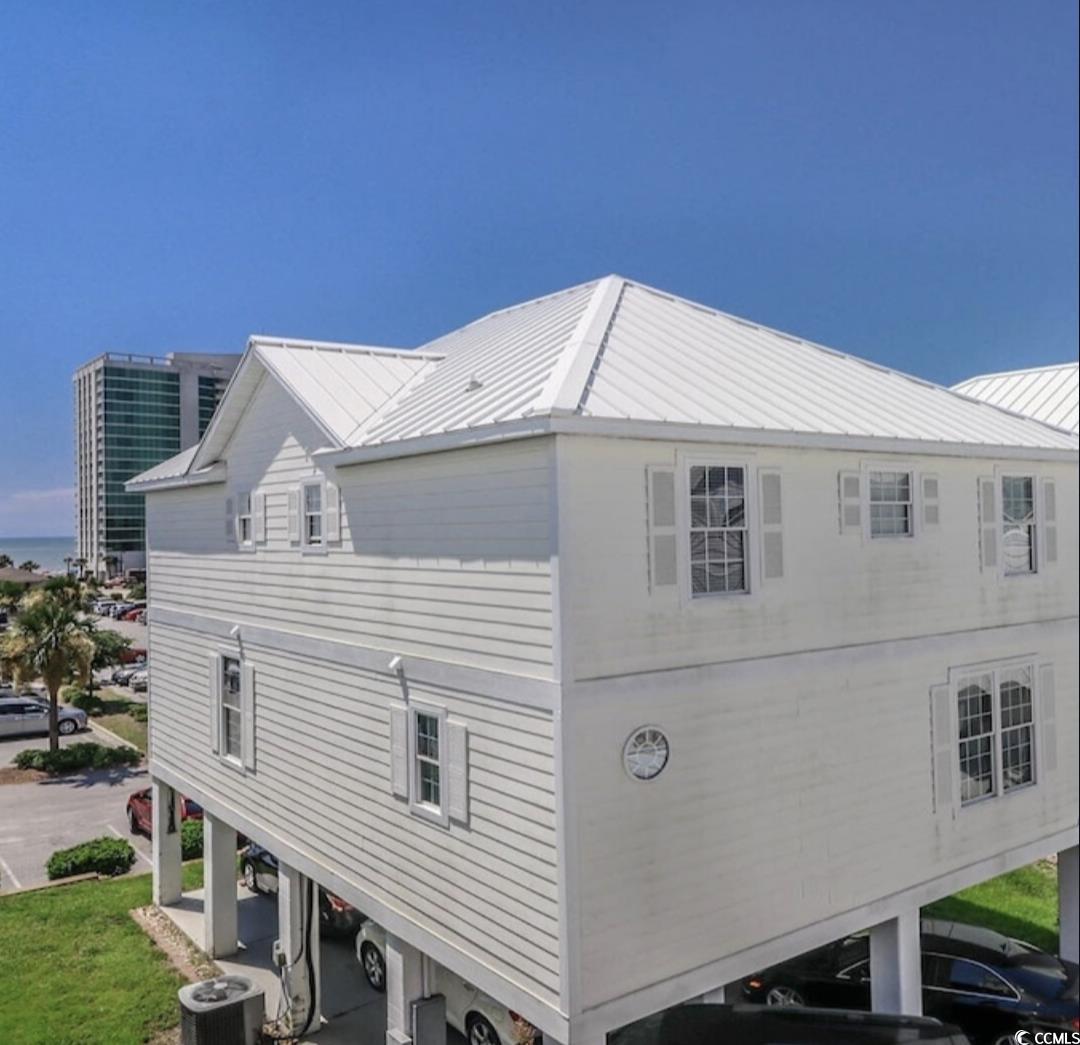 511 Caribbean Way Myrtle Beach, SC 29577 - Photo 17 of 17 View of home's exterior with a carport and cooling unit