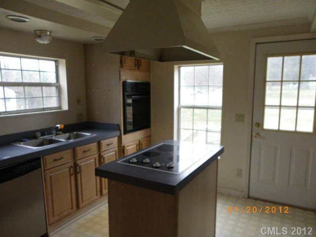 151 Hambright Road Clover, SC 29710 - Photo 4 of 11 a kitchen with a sink stove and cabinets