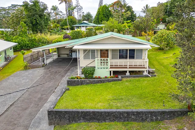 a front view of a house with swimming pool
