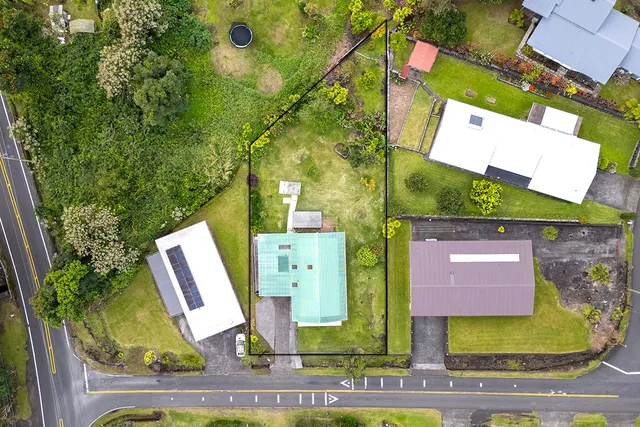 an aerial view of a house with swimming pool