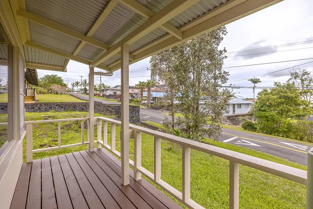 a view of a balcony with wooden floor