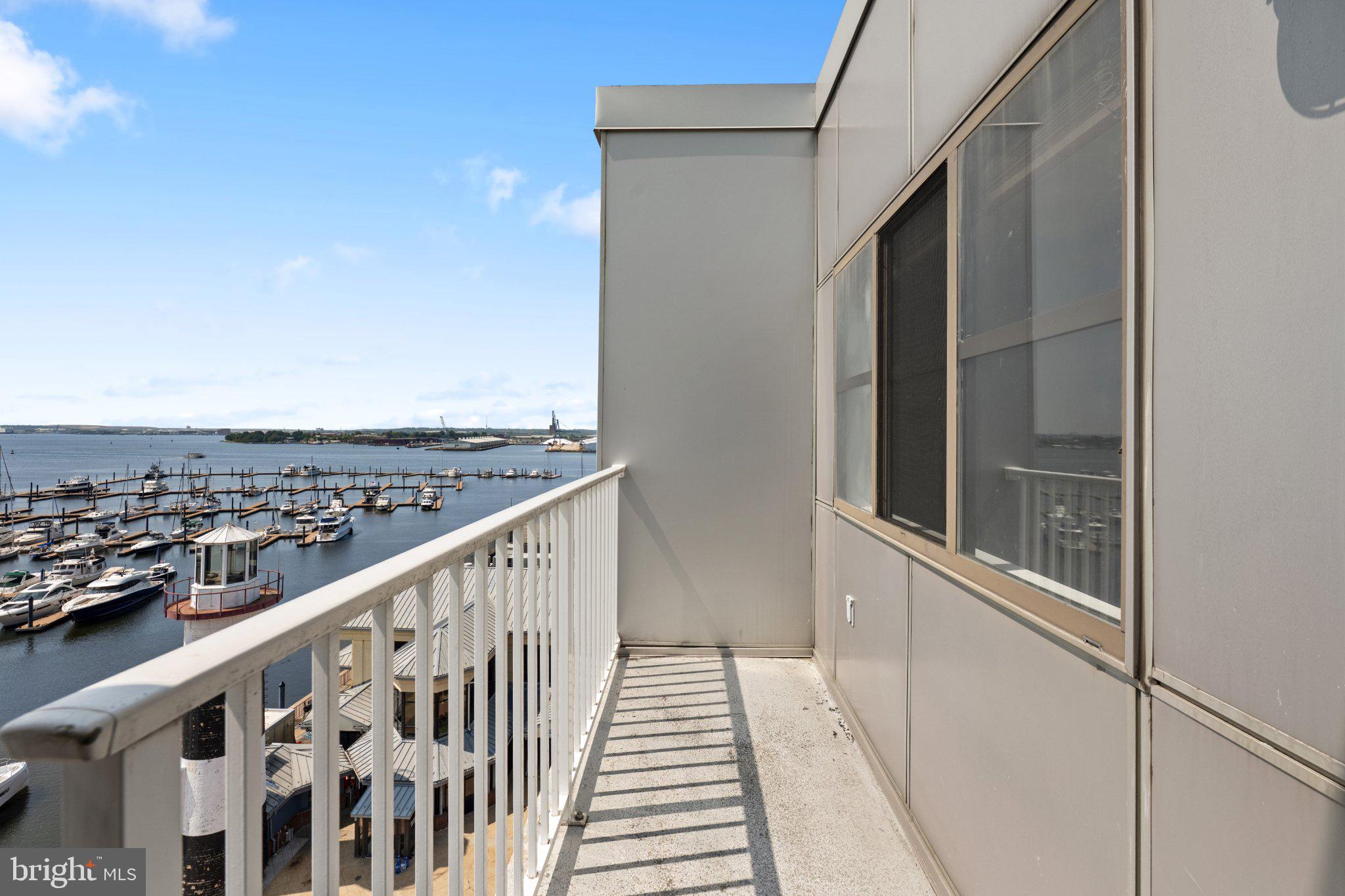 2702 Lighthouse Point East, Unit 738 Baltimore, MD 21224 - Photo 31 of 33 Scenic waterfront balcony view.