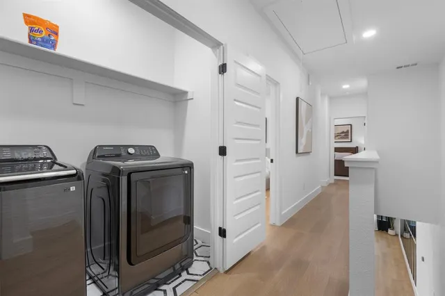 a utility room with closet dryer and washer