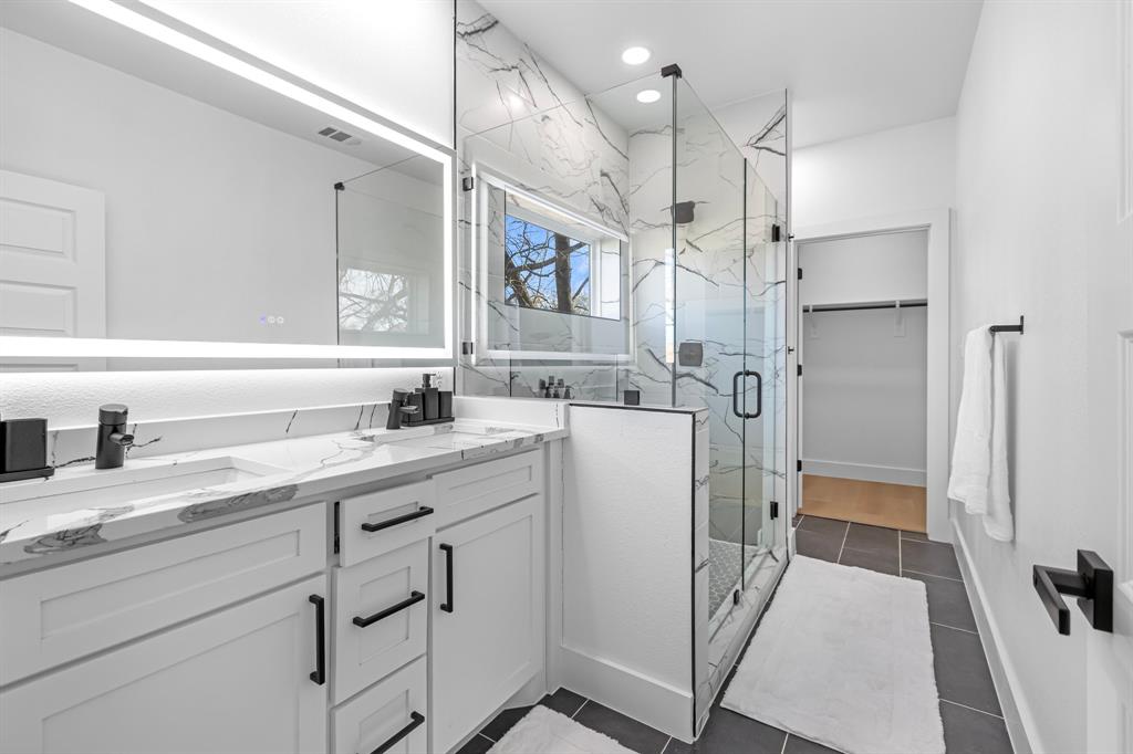 1511 Barry Avenue Dallas, TX 75223 - Photo 7 of 14 a kitchen with a sink stainless steel appliances and cabinets