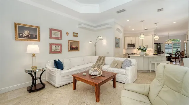 a living room with furniture and a lamp
