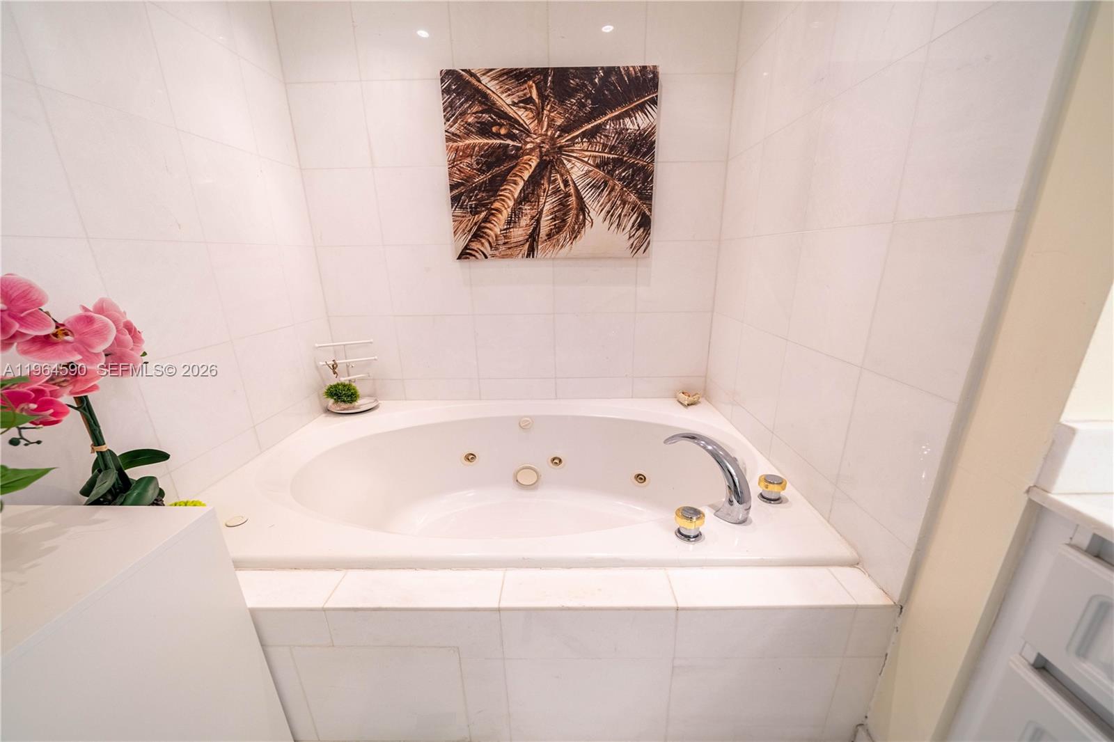 6301 Collins Avenue, Unit 2802 Miami Beach, FL 33141 - Photo 21 of 28 a bathroom with a bathtub and a shower