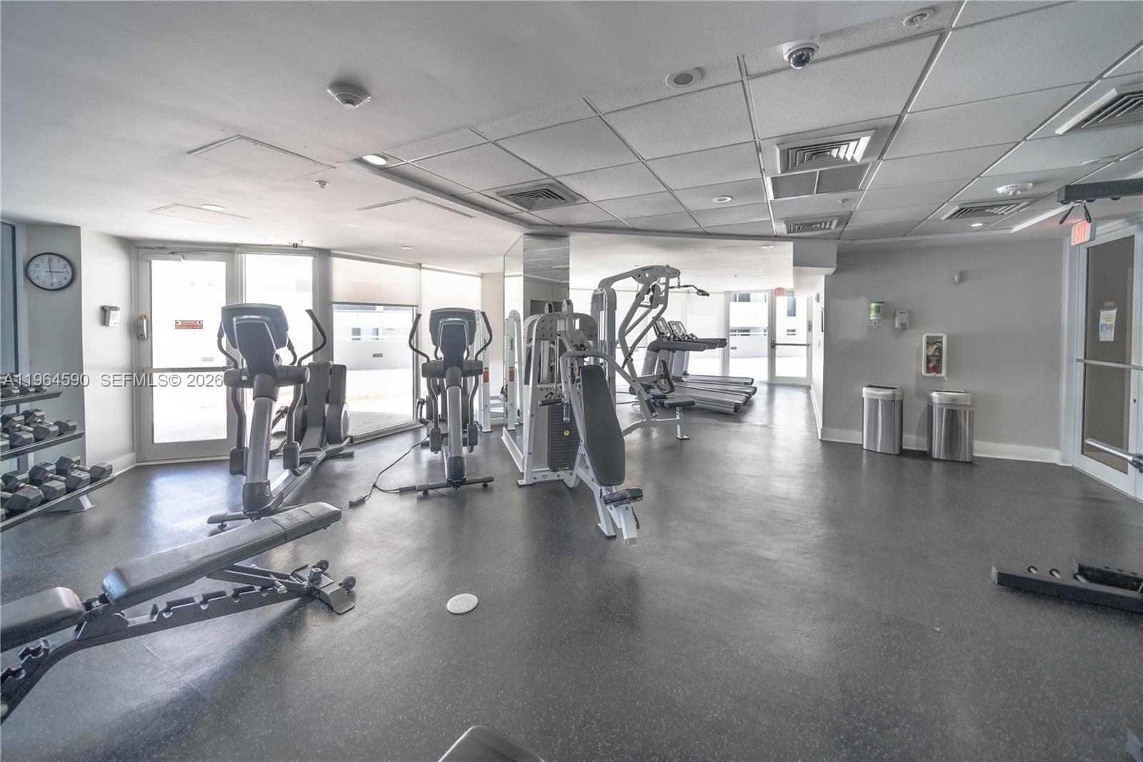 6301 Collins Avenue, Unit 2802 Miami Beach, FL 33141 - Photo 23 of 28 a view of a room with gym equipment