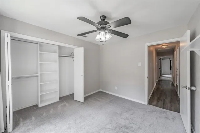 a view of a hallway with closet area