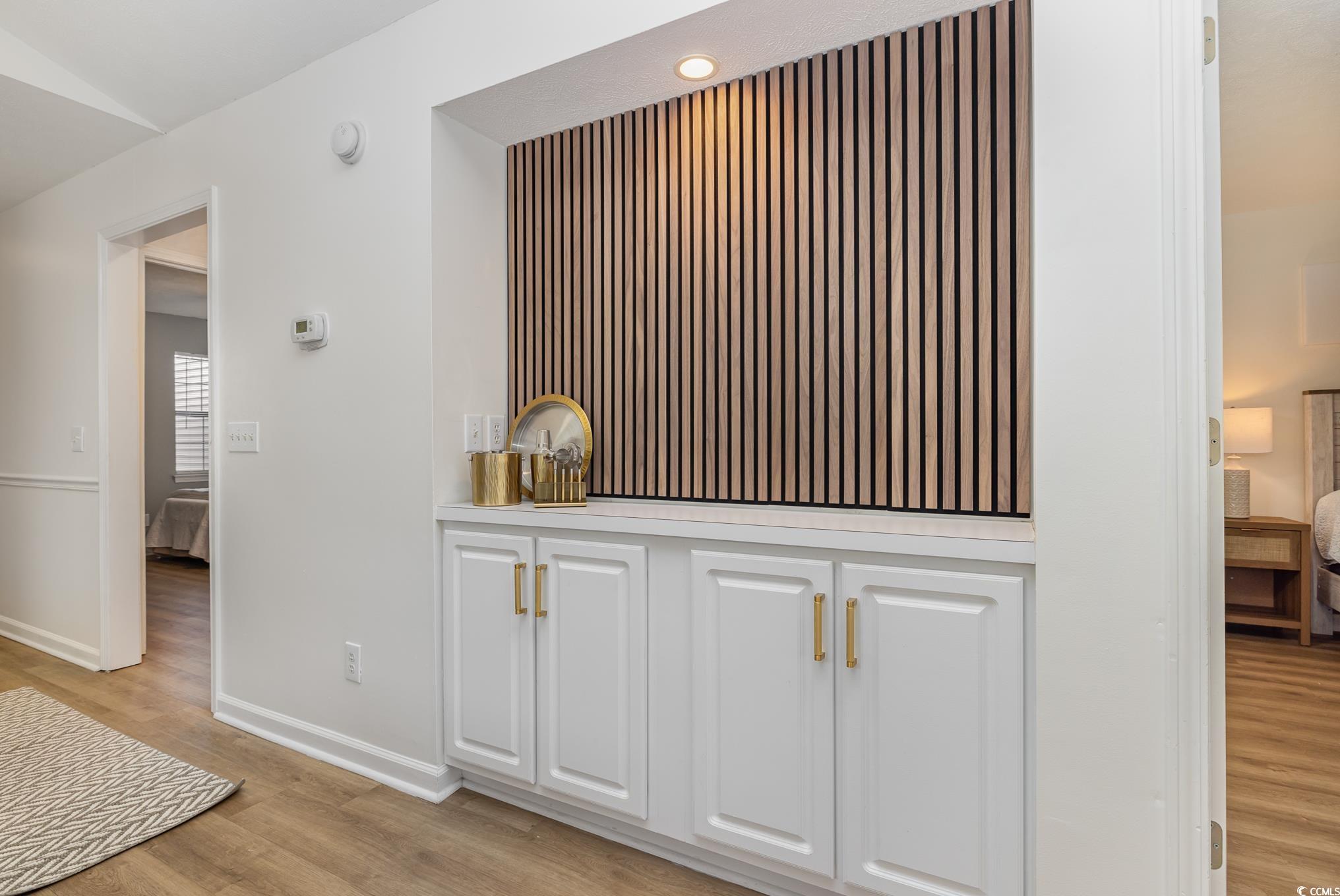 504 Pinehurst Lane, Unit 18H Pawleys Island, SC 29585 - Photo 20 of 28 Detailed view of wood finished floors and baseboards