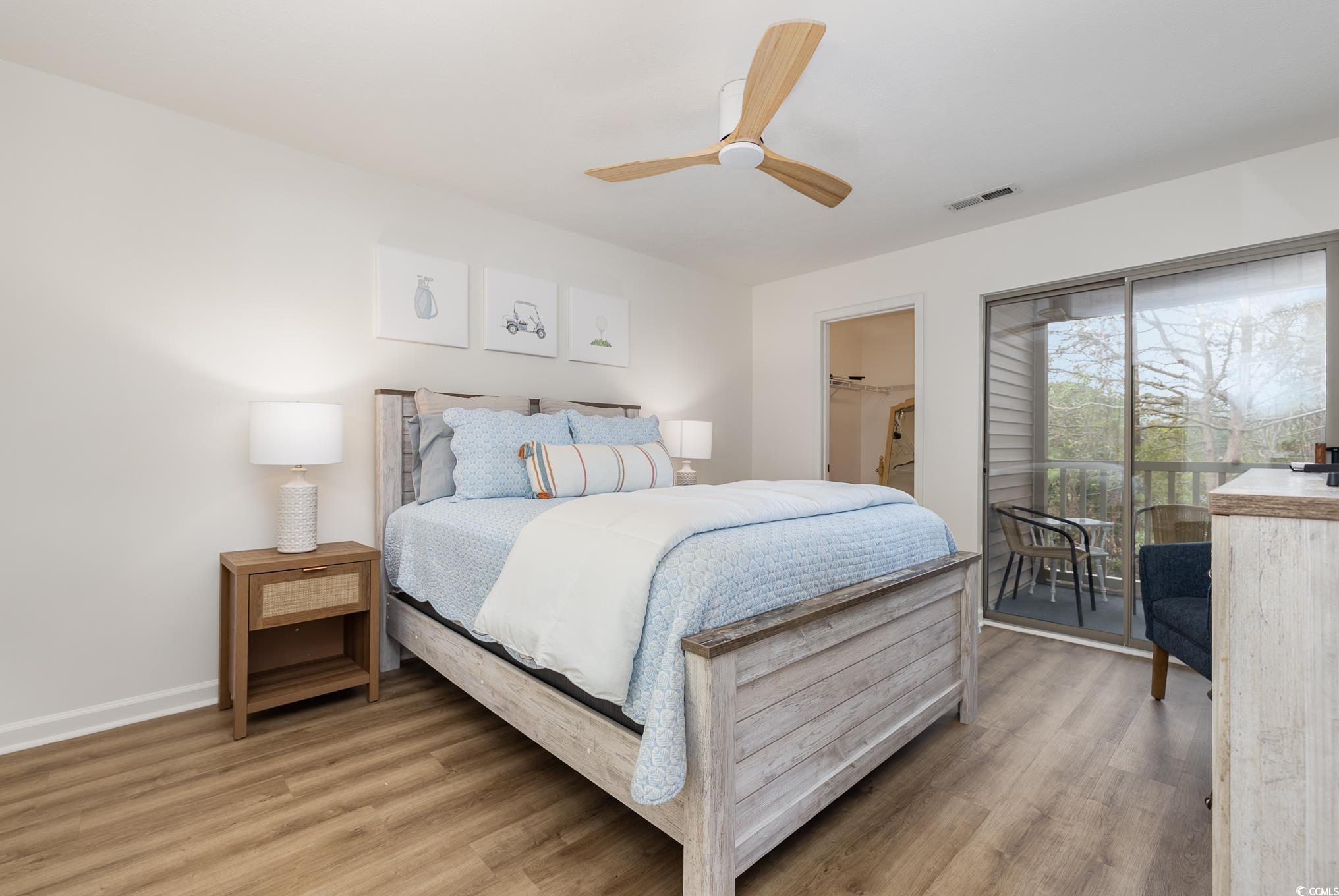 504 Pinehurst Lane, Unit 18H Pawleys Island, SC 29585 - Photo 21 of 28 Bedroom featuring access to outside, light wood-style floors, and ceiling fan