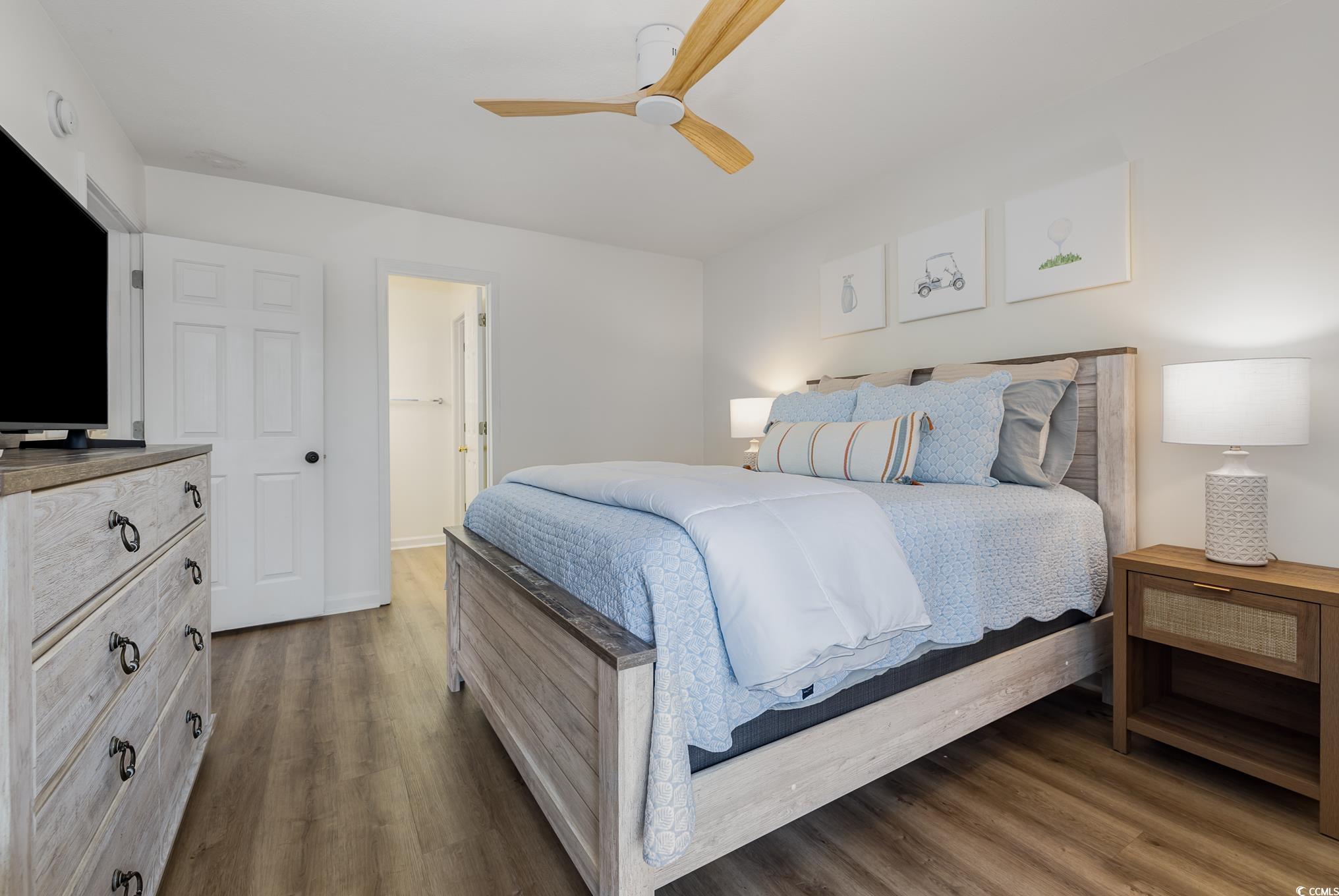 504 Pinehurst Lane, Unit 18H Pawleys Island, SC 29585 - Photo 23 of 28 Bedroom with a ceiling fan and wood finished floors