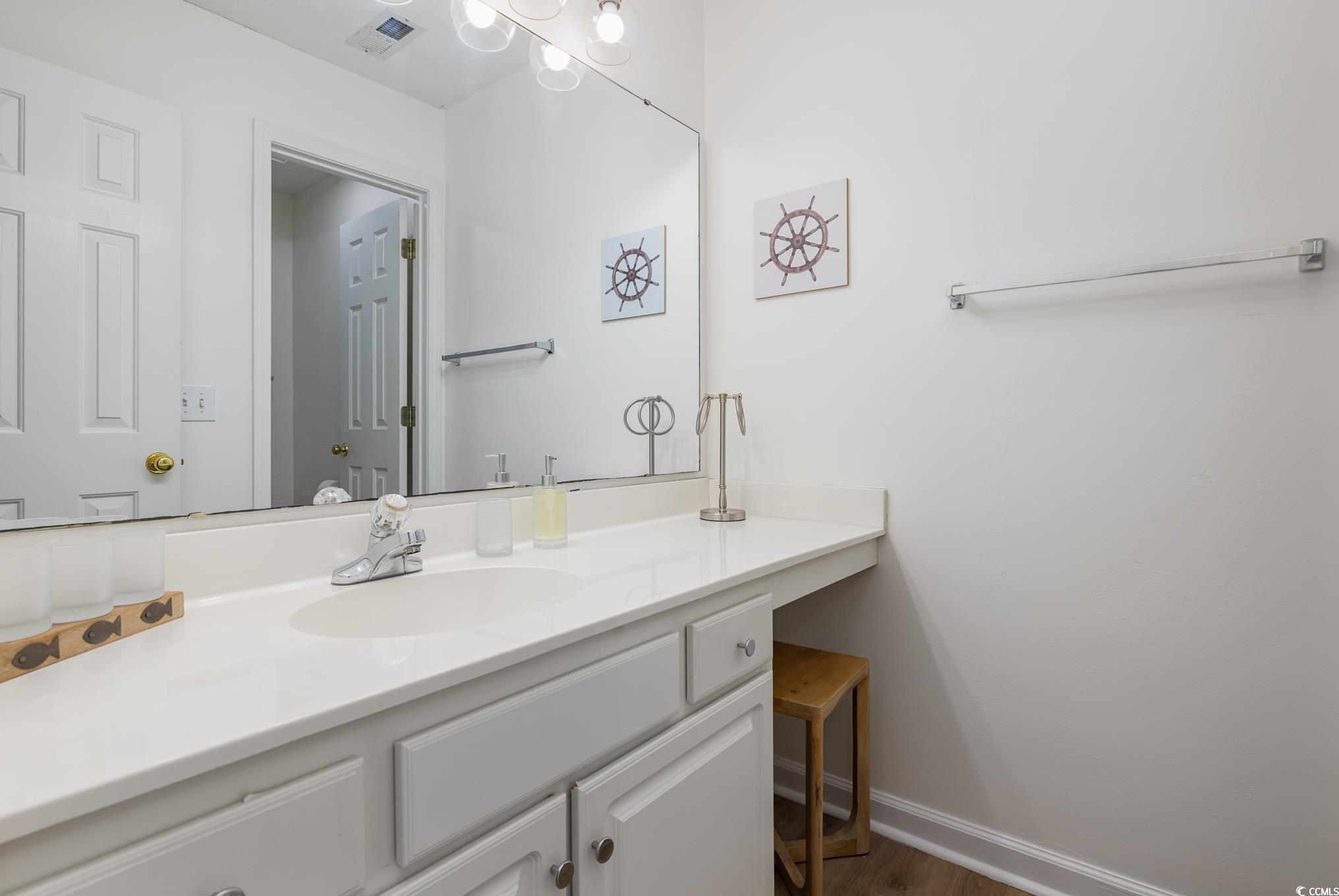 504 Pinehurst Lane, Unit 18H Pawleys Island, SC 29585 - Photo 24 of 28 Bathroom featuring vanity and light wood-style floors