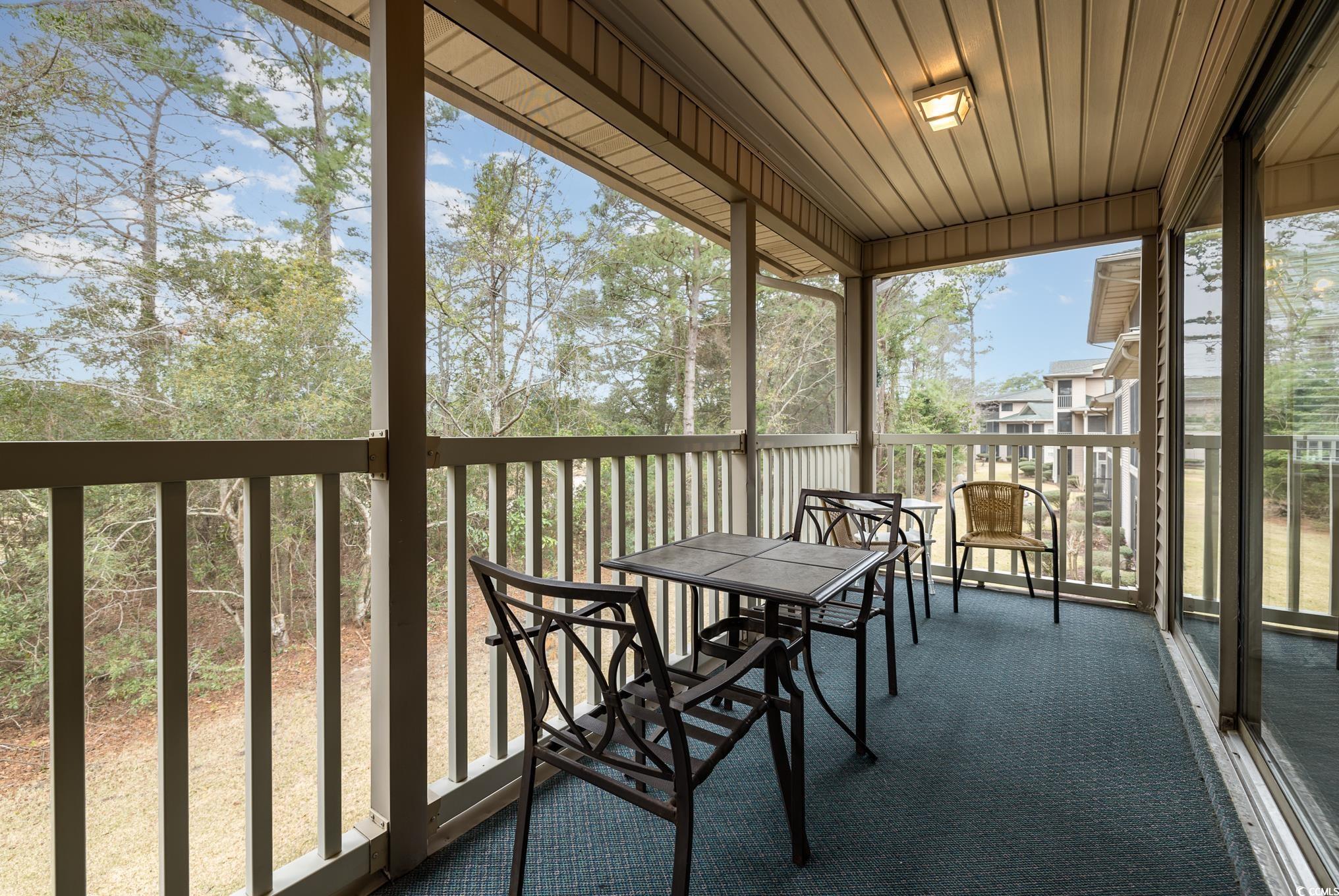 504 Pinehurst Lane, Unit 18H Pawleys Island, SC 29585 - Photo 27 of 28 Sunroom / solarium with a balcony